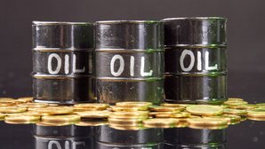 barrels-with-oil-golden-coins-reflective-desk.jpg